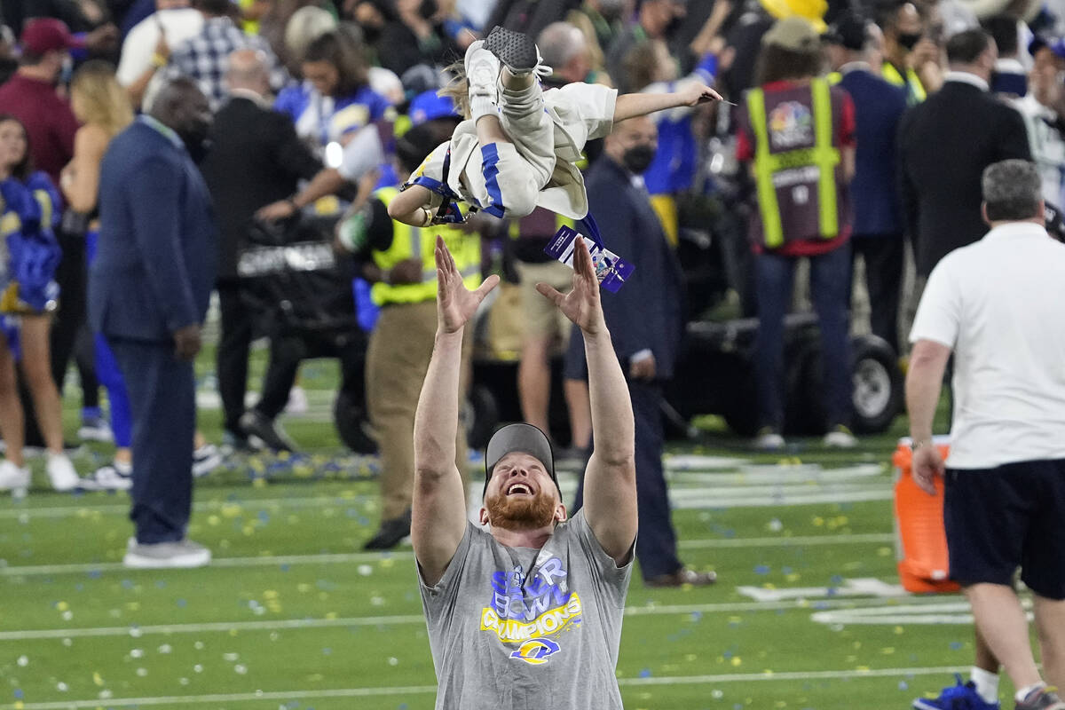 Los Angeles Rams punter Johnny Hekker (6) tosses his daughter in the air after the NFL Super Bo ...