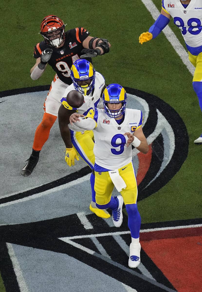 Los Angeles Rams quarterback Matthew Stafford (9) aims a pass during the second half of the NFL ...