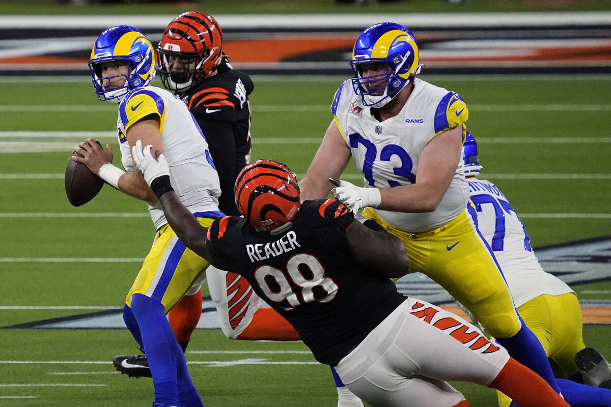 Los Angeles Rams quarterback Matthew Stafford (9) works in the pocket before being sacked by Ci ...