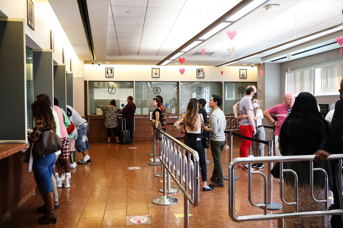 Couples wait in line for marriage certificates at the Marriage License Bureau on Sunday, Feb. 1 ...