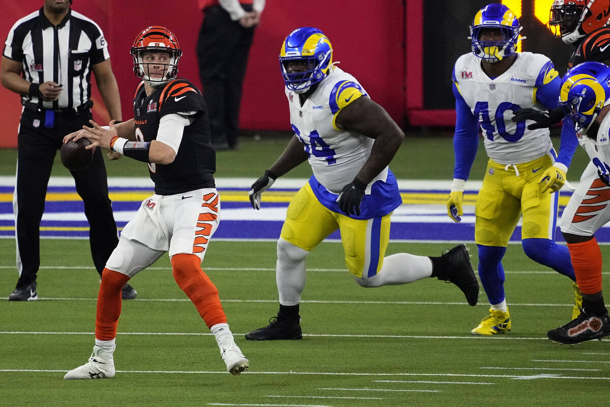 Cincinnati Bengals quarterback Joe Burrow (9) looks to pass against the Los  Angeles Rams during …