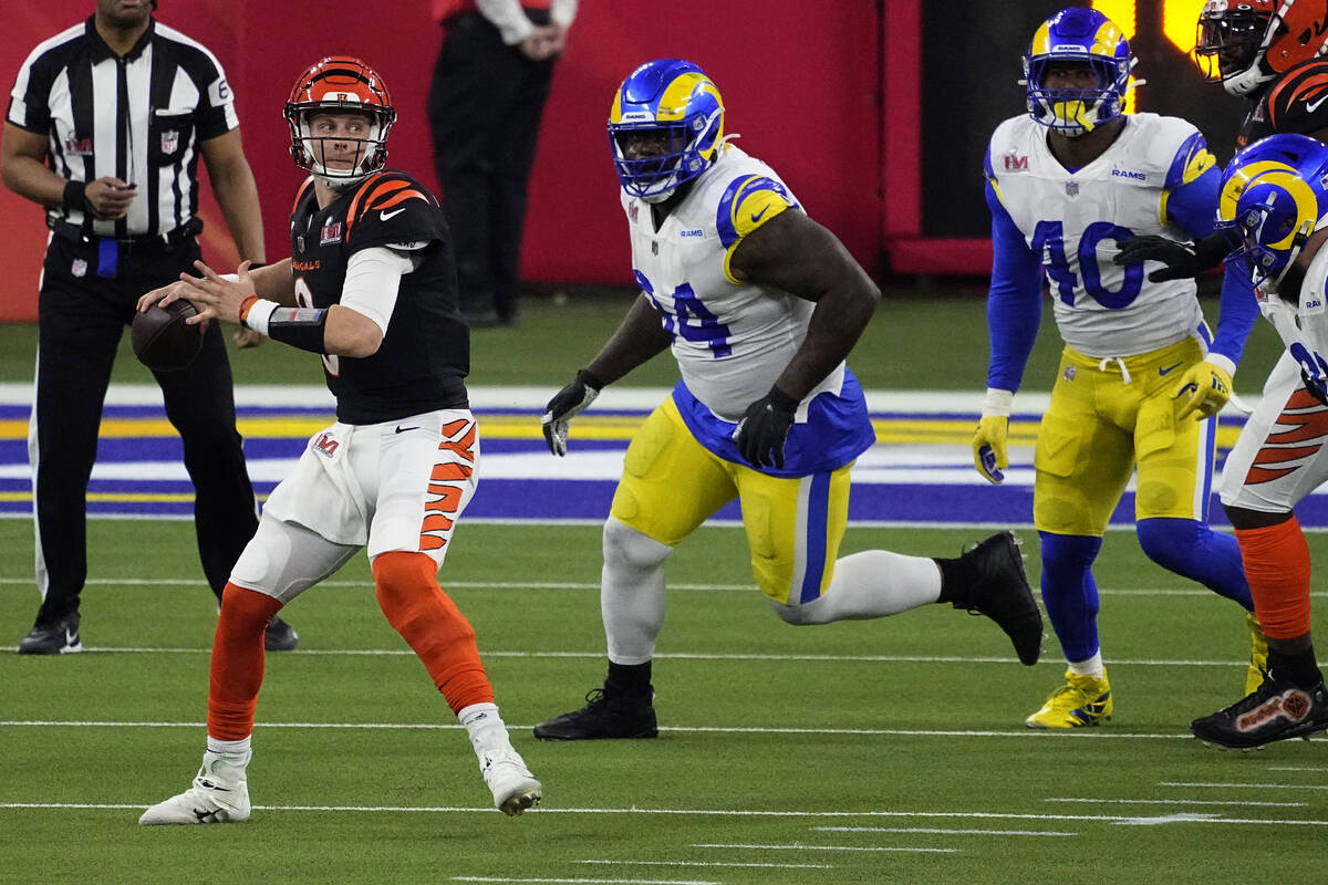 Cincinnati Bengals quarterback Joe Burrow (9) looks to pass against the Los Angeles Rams during ...