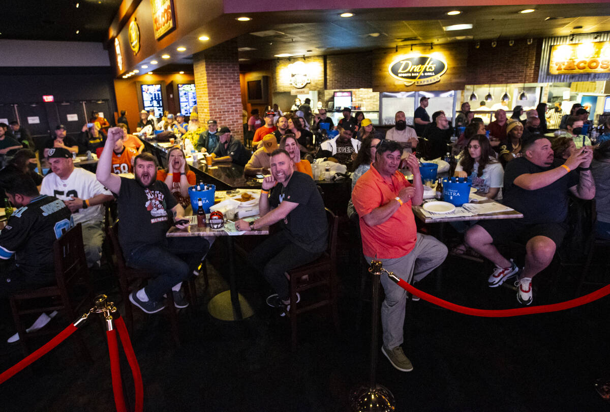 Attendees cheer for the Cincinnati Bengals at the start of the Super Bowl during a watch party ...