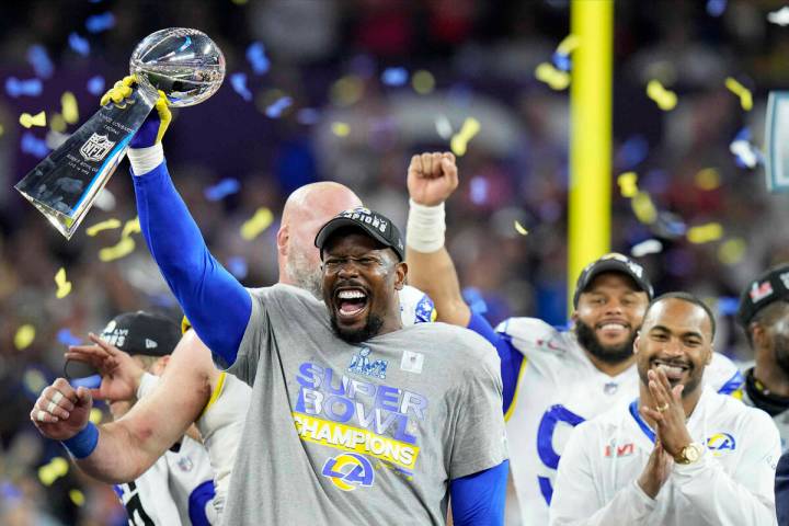 Los Angeles Rams outside linebacker Von Miller lifts the the Lombardi Trophy after the Rams def ...