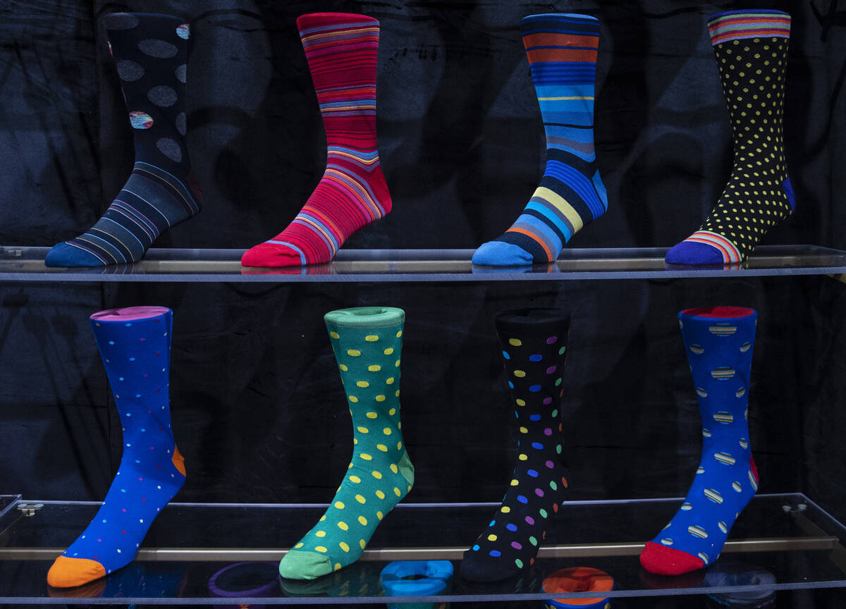 Designer socks at Imani UOMO’s booth are displayed at the biannual MAGIC show, a trend-d ...