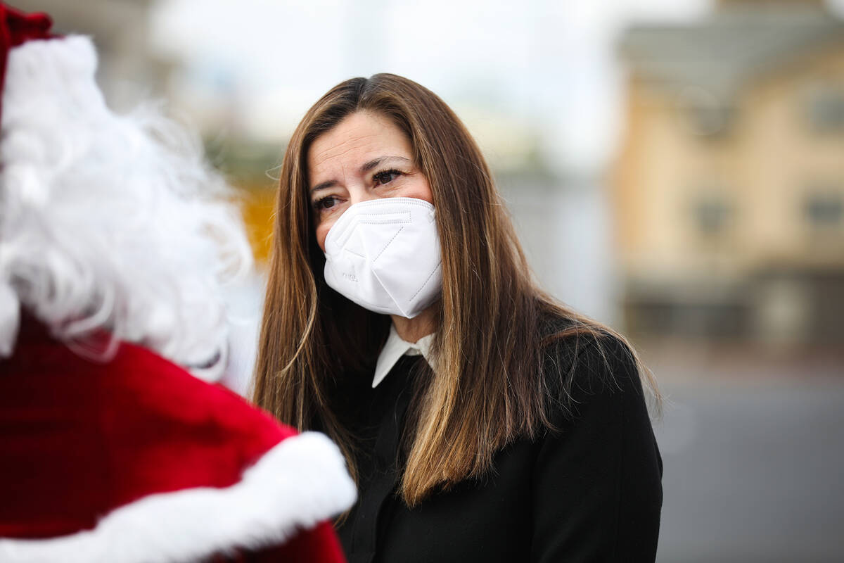 Lt. Gov. Lisa Cano Burkhead speaks with Santa Claus, or Bruce Eddins, administrator for Horizon ...