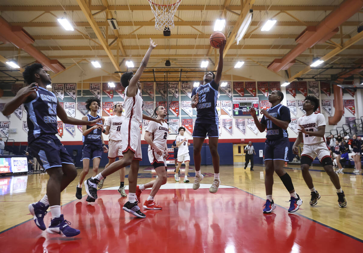 Canyon Springs' Jaylen Pollard (12) lays up the ball against Coronado during the second half of ...