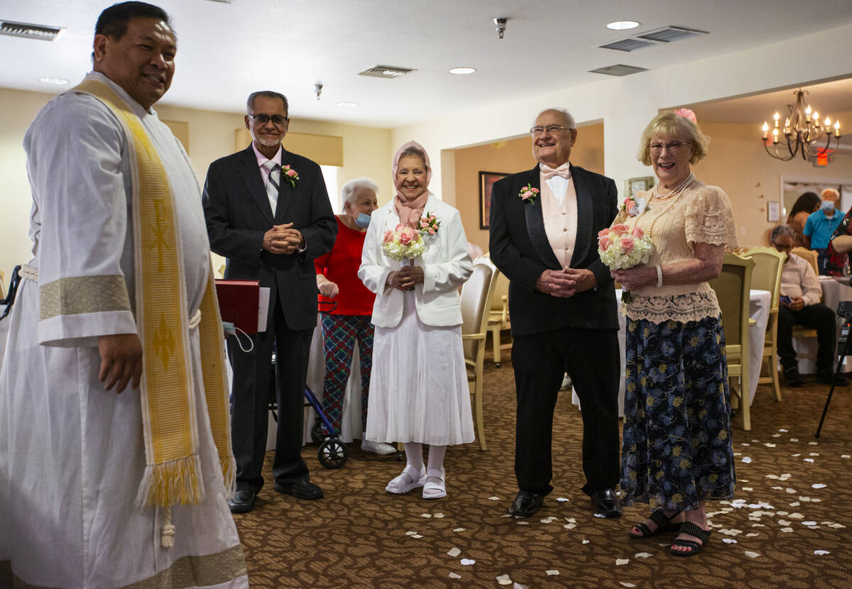 Pastor Jeremiah Castorillo, left, leads a group Valentine's Day vow renewal ceremony as partici ...