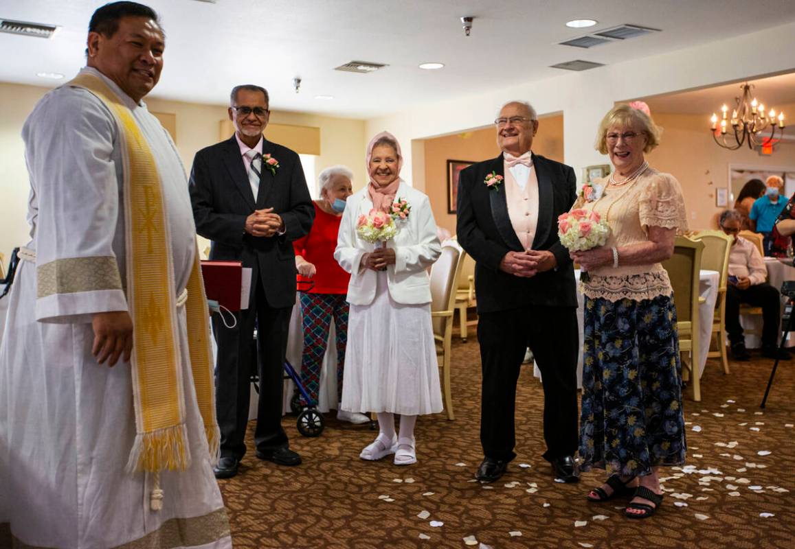 Pastor Jeremiah Castorillo, left, leads a group Valentine's Day vow renewal ceremony as partici ...