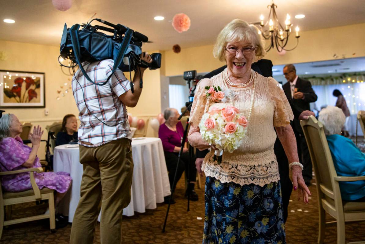 Goldie Barben walks by during a group vow renewal ceremony on Valentine's Day at Sterling Ridge ...