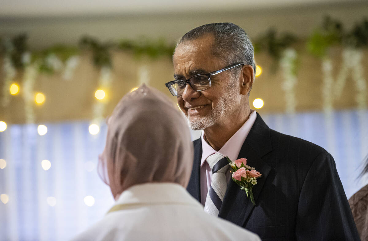 Benjamin Saez looks on during a group vow renewal ceremony on Valentine's Day at Sterling Ridge ...