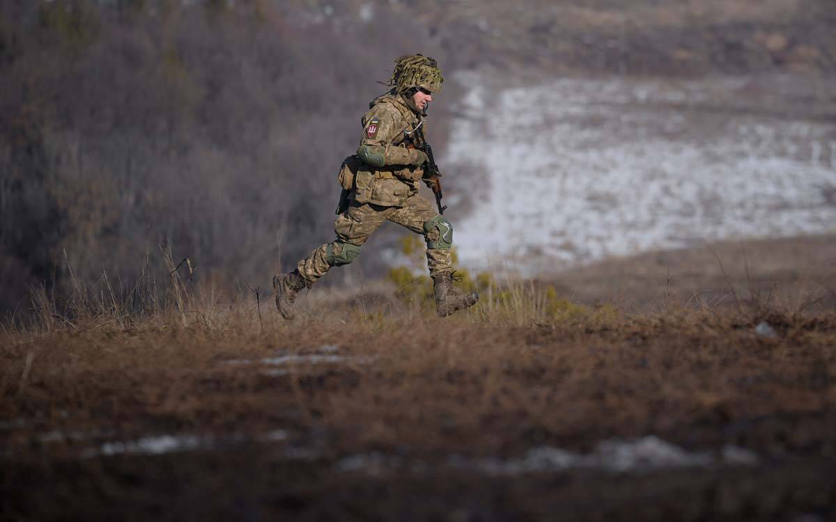 A Ukrainian serviceman runs during an exercise in the Joint Forces Operation, in the Donetsk re ...
