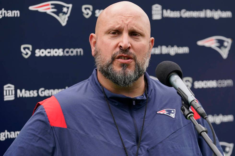 New England Patriots offensive line coach Carmen Bricillo faces reporters following an NFL foot ...