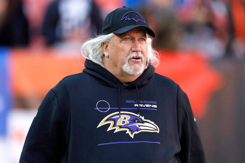 Baltimore Ravens inside linebackers coach Rob Ryan walks onto the field before an NFL football game...