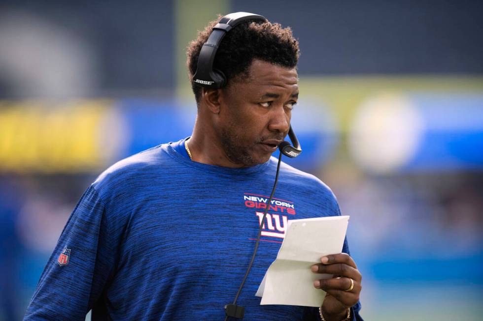 New York Giants defensive coordinator Patrick Graham stands on the field before the NFL team...