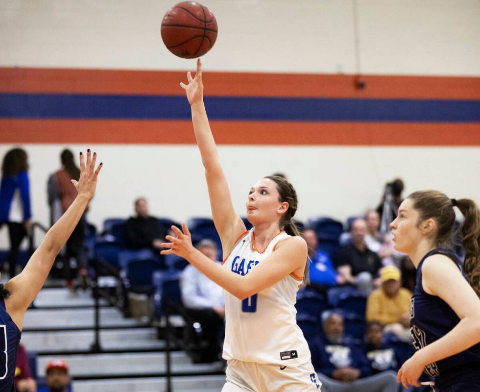 Bishop Gorman guard Silvia Garcia (1) shoots over Spring Valley defenders in the first half dur ...