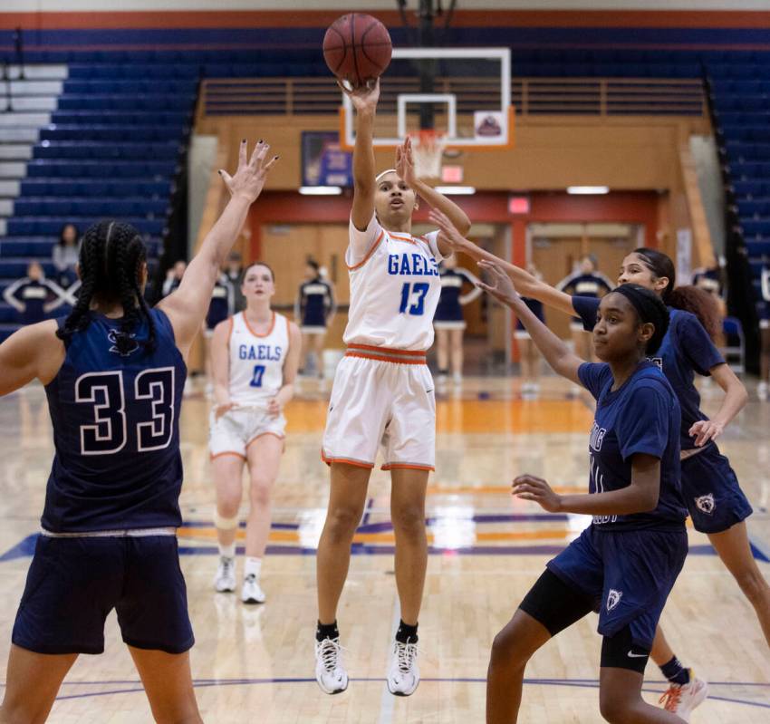 Bishop Gorman guard Reina Bell (13) shoots over Spring Valley forward Briana Green (33) in the ...