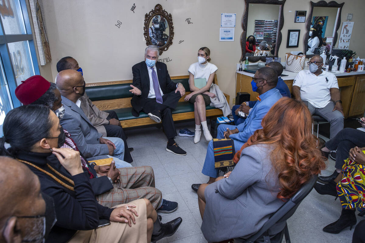 Gov. Steve Sisolak, center, responds to a request for change made to him as he meets with Black ...