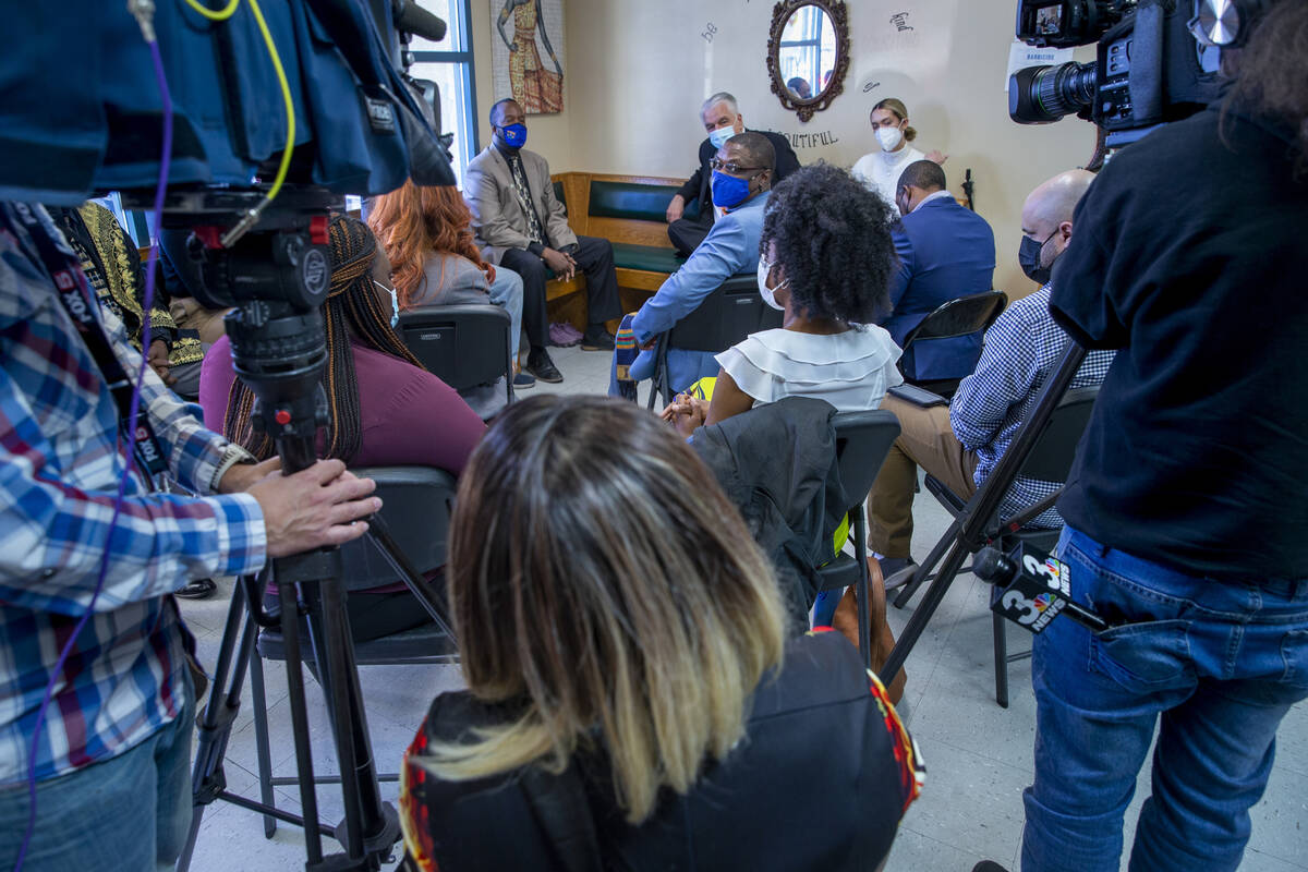 Gov. Steve Sisolak and other invited guests listen to a response as he meets with Black busines ...