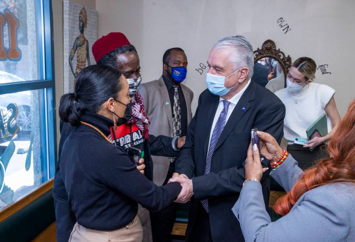 Tiffany, from left, and Patrick Eholor with Tribal Exchange Global thank Gov. Steve Sisolak for ...