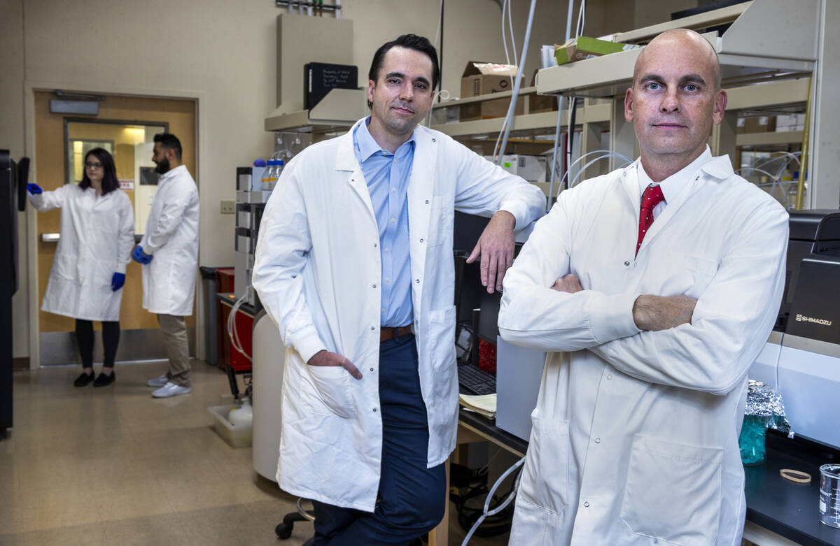 Dr. Jefferson Kinney, right, and Dr. Aaron Ritter in the Transitional Biomarker Discovery Labor ...
