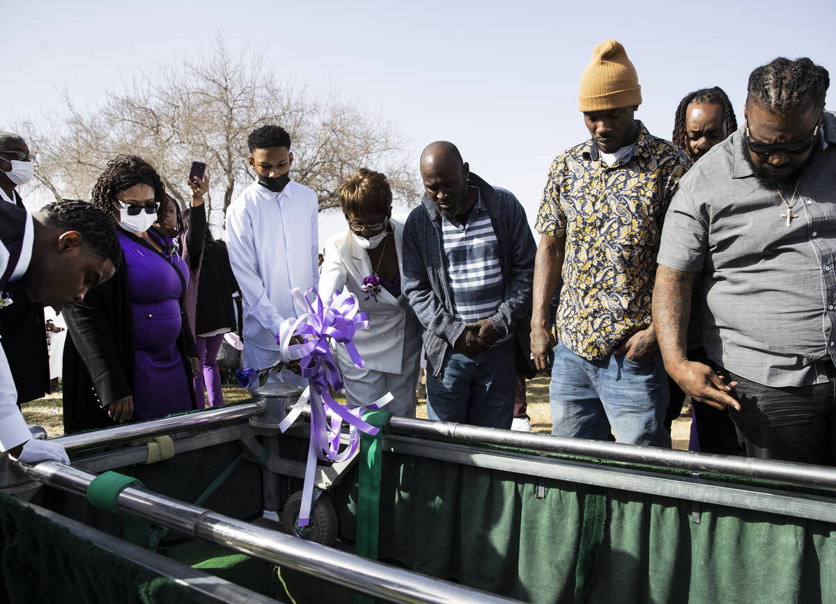Cynthia Miller, the mother of Tanaga Miller, one of 9 people killed in the NLV crash, throws a ...
