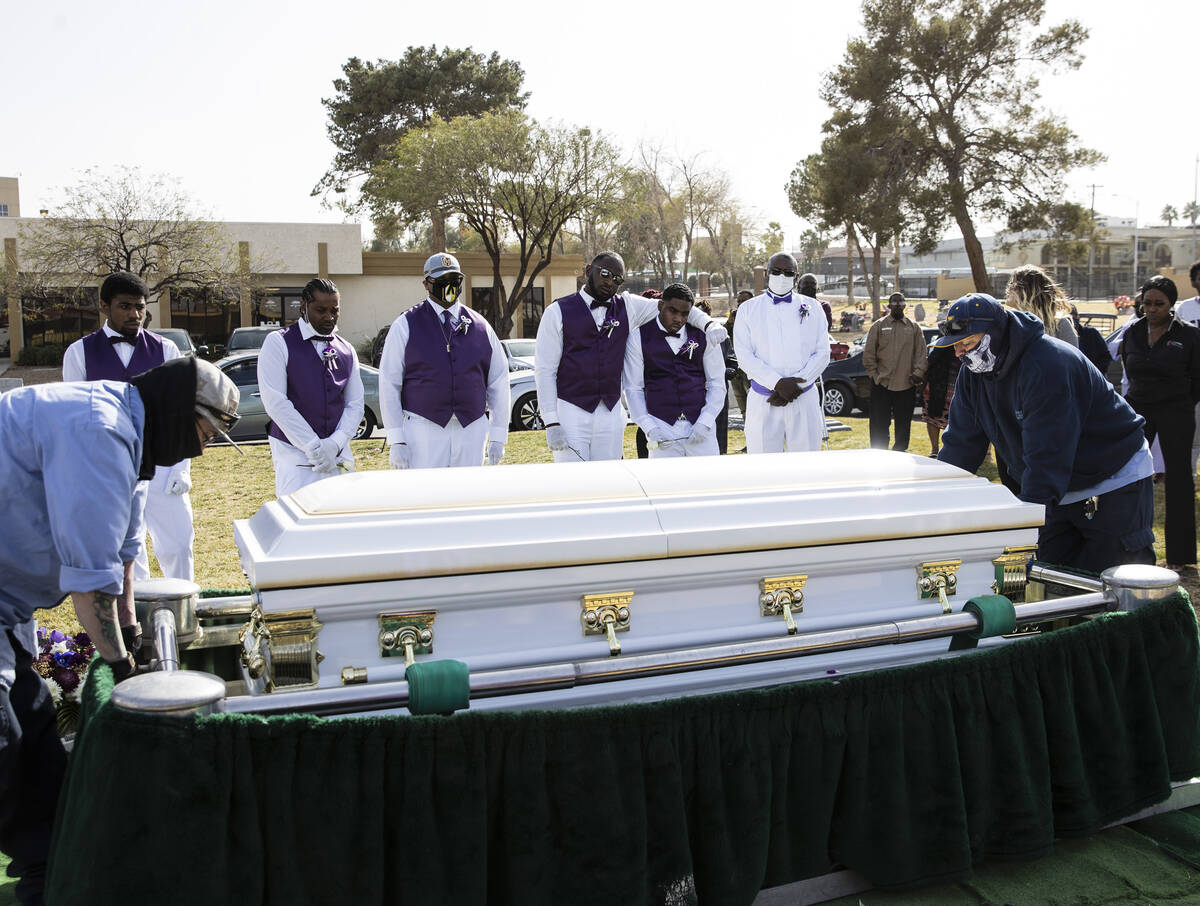 Pallbearers, including Gino Milliner, second right, the brother of Tanaga Miller, one of 9 peop ...