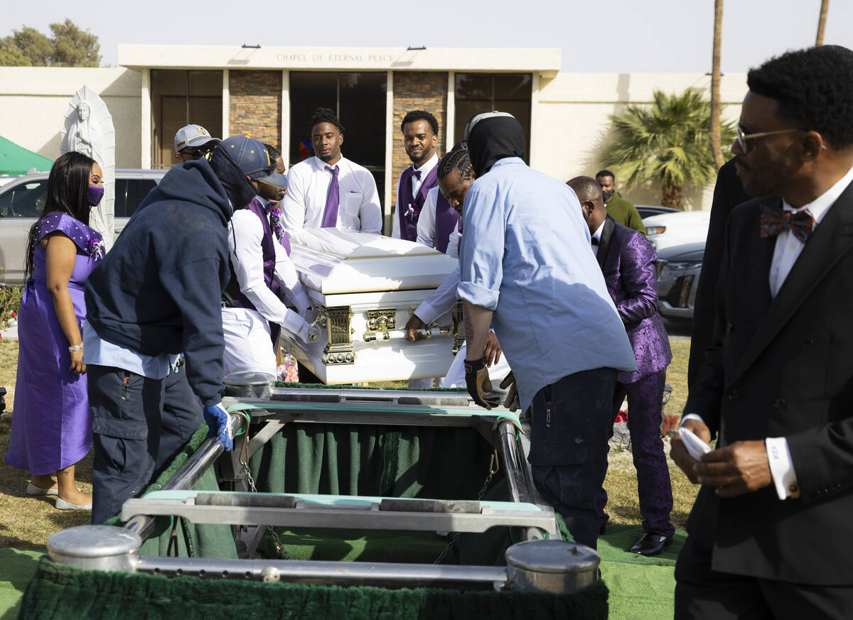 Pallbearers carry the casket of Tanaga Miller, one of 9 people killed in the NLV crash, to his ...