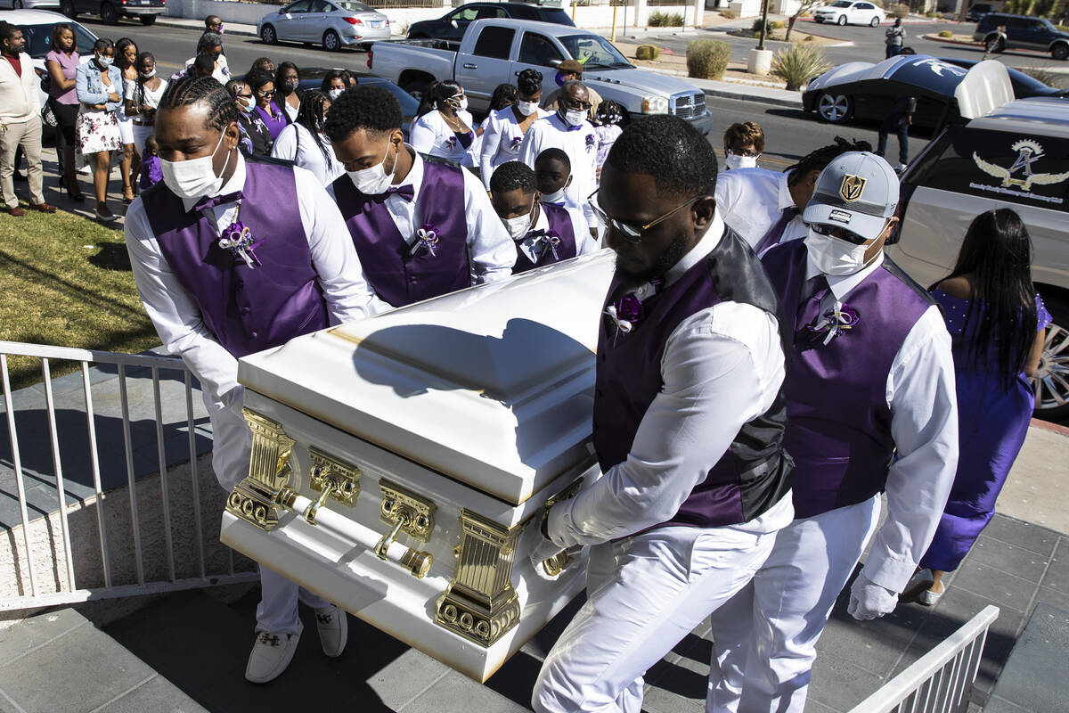 Pallbearers carry the casket of Tanaga Miller, one of 9 people killed in the NLV crash, into Po ...