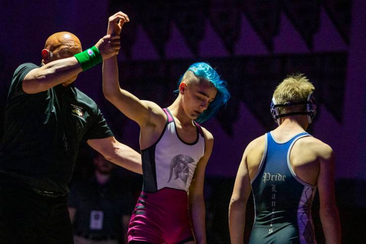 Cimarron-Memorial's Otto Cate-Cribari, left, defeats McQueen's Preston Harn in their 120 pound ...