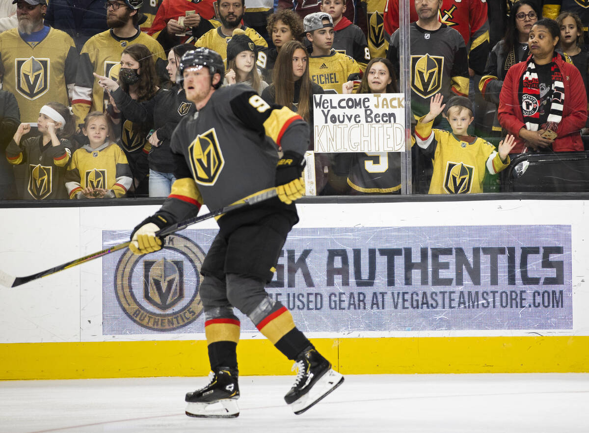 Fans of Golden Knights center Jack Eichel (9) watch him warm up before the start of an NHL hock ...