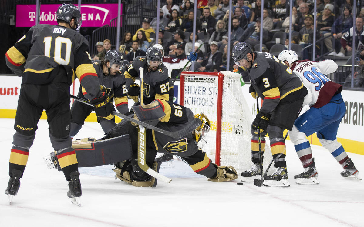 Golden Knights goaltender Laurent Brossoit (39) makes a save against Colorado Avalanche right w ...