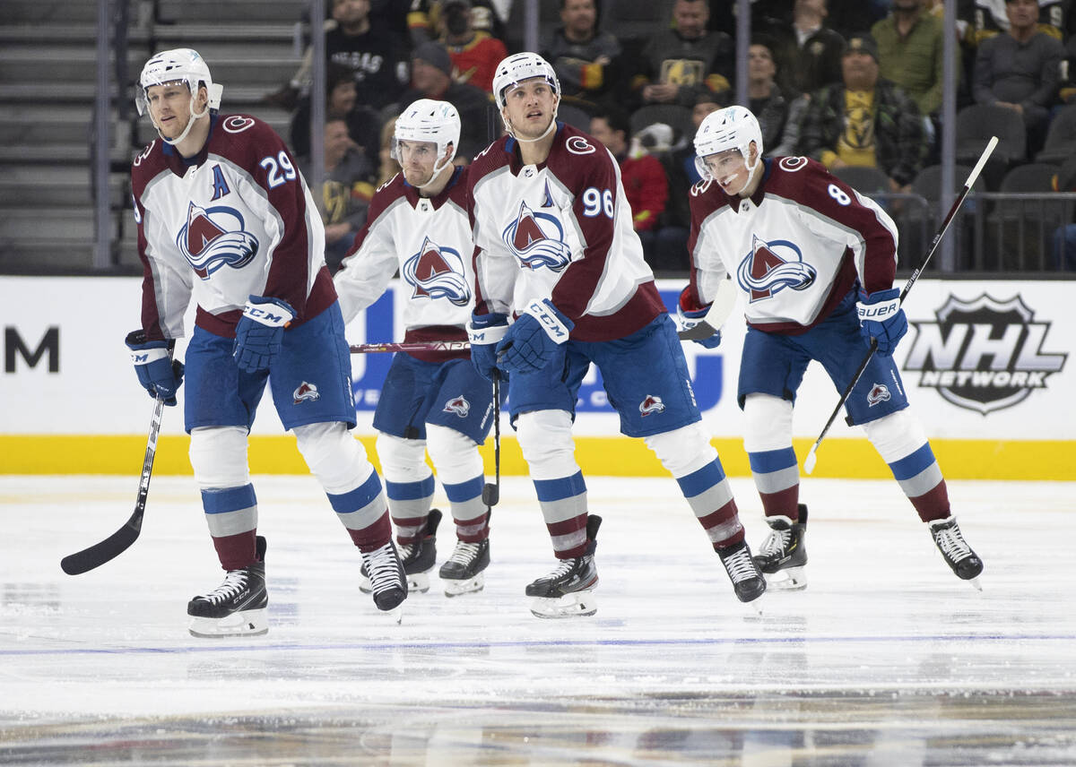 Colorado Avalanche players celebrate a goal in the third period during an NHL hockey game again ...