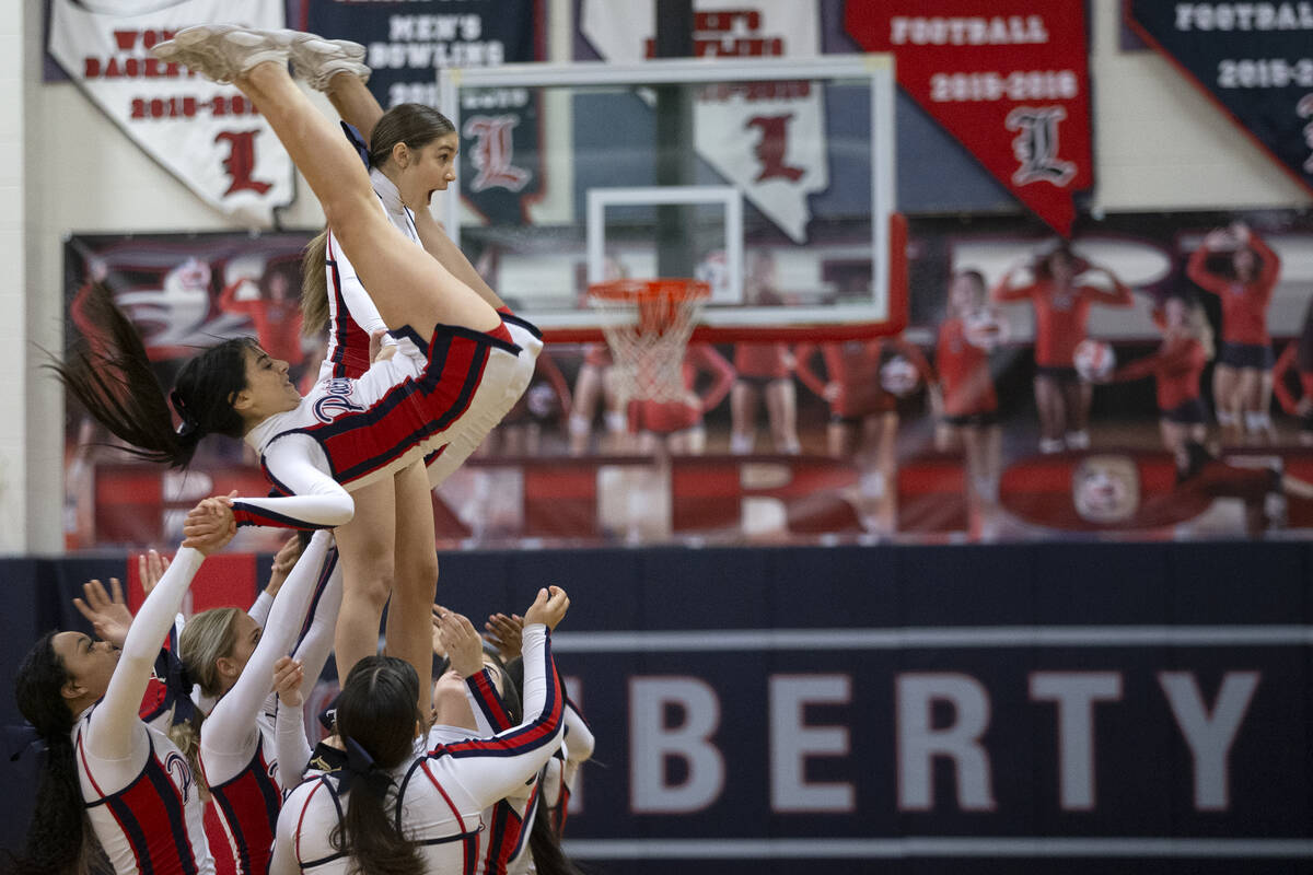Liberty’s cheerleading team performs at halftime during a high school Southern Region to ...