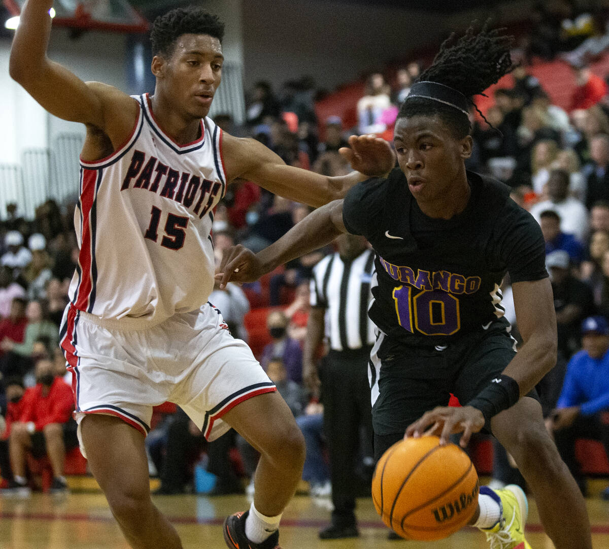 Durango’s Tylen Riley (10) drives around Liberty’s Aaron Price (15) during a high ...