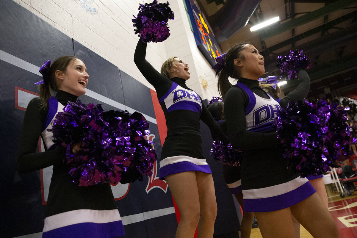 Durango’s cheerleading team celebrate after their team scored a point during a high scho ...