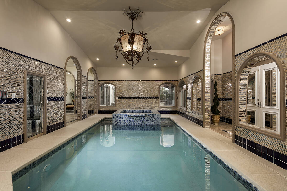 The luxury Tournament Hills mansion includes two swimming pools — one outdoor and one indoor. ...