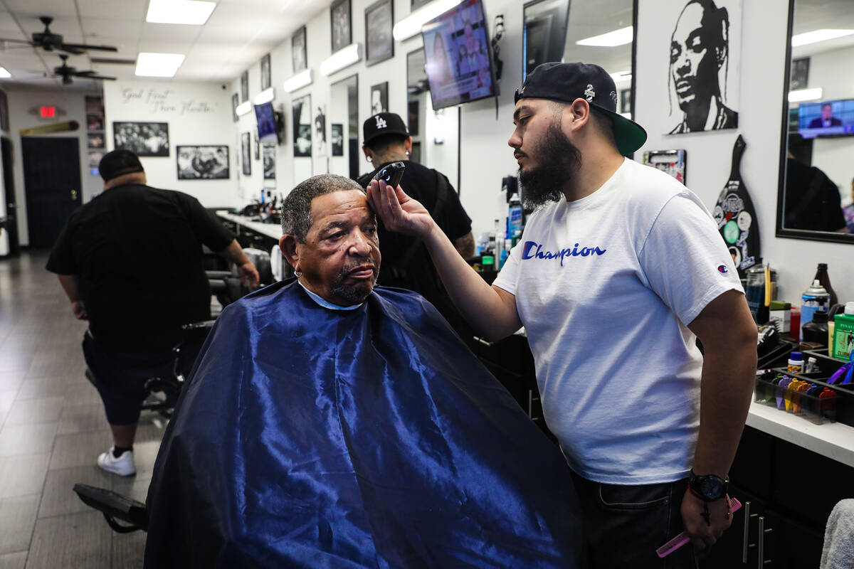 Geo Jimenez cuts the hair of Joseph Clark on Thursday, Feb. 17, 2022 at Icon Barbershop in Las ...