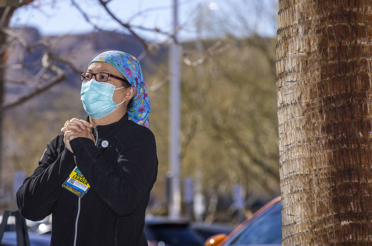 ICU Charge Nurse Arlice Rigodon listens intently as ICU Physician Ahmad during a nondenominatio ...