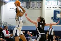 Desert Oasis Hailey Mannella (14) guards Centennial’s Charlece Ohiaeri (3) while she loo ...