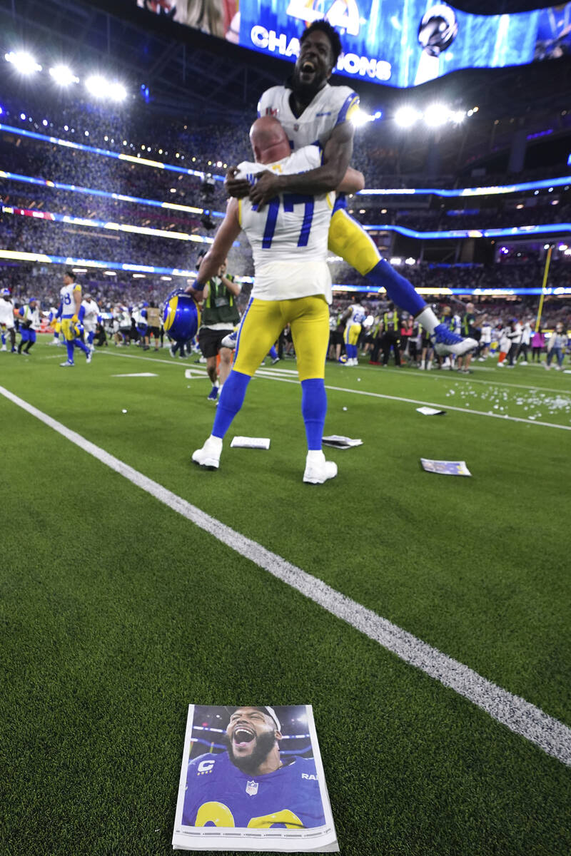 Los Angeles Rams offensive lineman Andrew Whitworth (77) holds up linebacker Leonard Floyd (54) ...