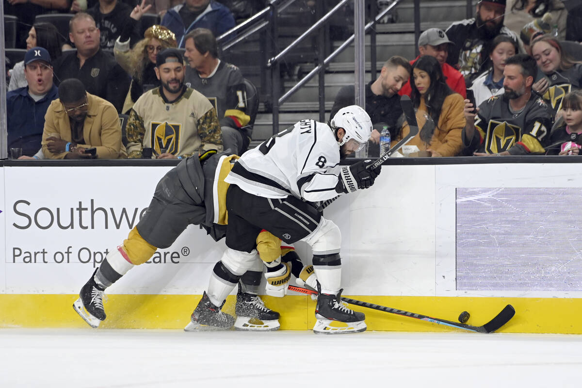 Los Angeles Kings defenseman Drew Doughty (8) and Vegas Golden Knights left wing William Carrie ...