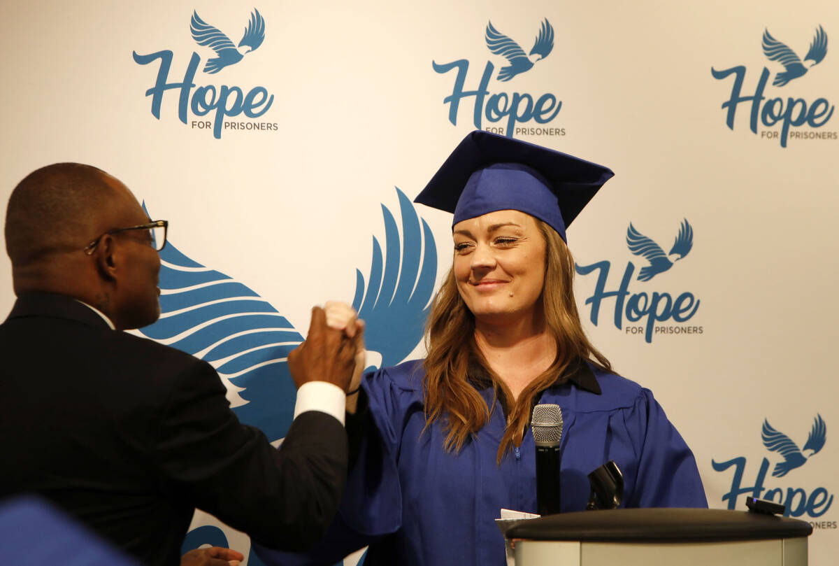 Jodie Eltzroth and Jon Ponder, founder and CEO of HOPE for Prisoners, high-five after Eltzroth' ...