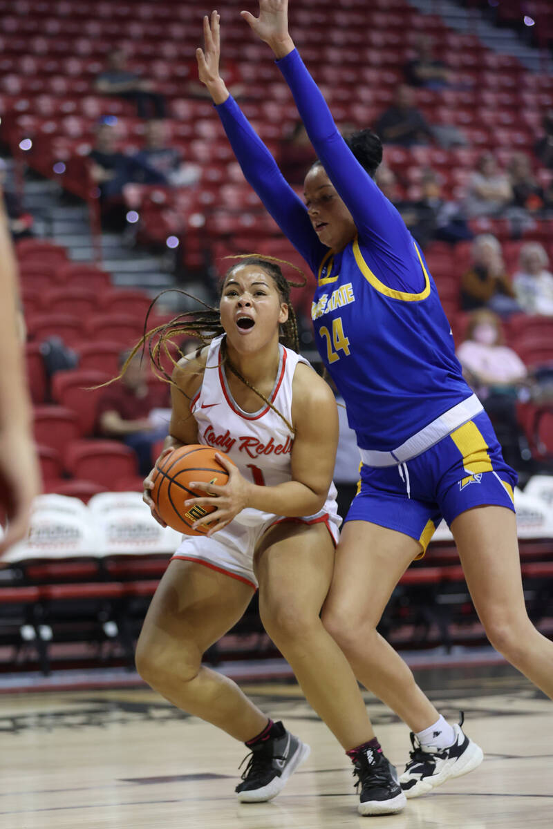 UNLV Lady Rebels Nneka Obiazor (1) looks for an open shot under pressure from San Jose Spartans ...