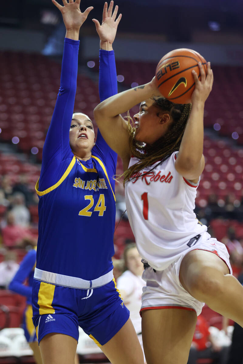 UNLV Lady Rebels Nneka Obiazor (1) goes up for a shot under pressure from San Jose Spartans Meg ...