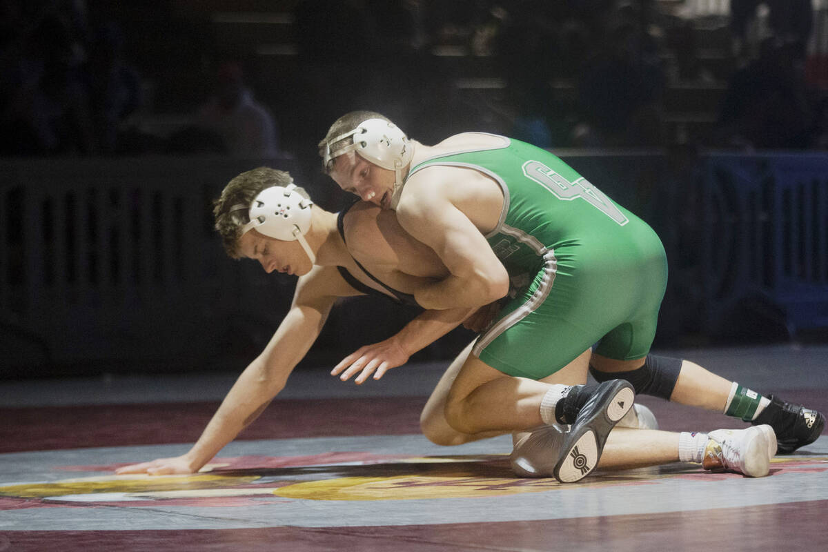 Nikolas Slatoff, right, of Green Valley High School wrestles Shane Hepner, from McQueen High Sc ...