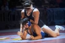 SLAM Nevada’s Gavin Thammavongsa, top, wrestles Isaac Garcia of McQueen High School duri ...