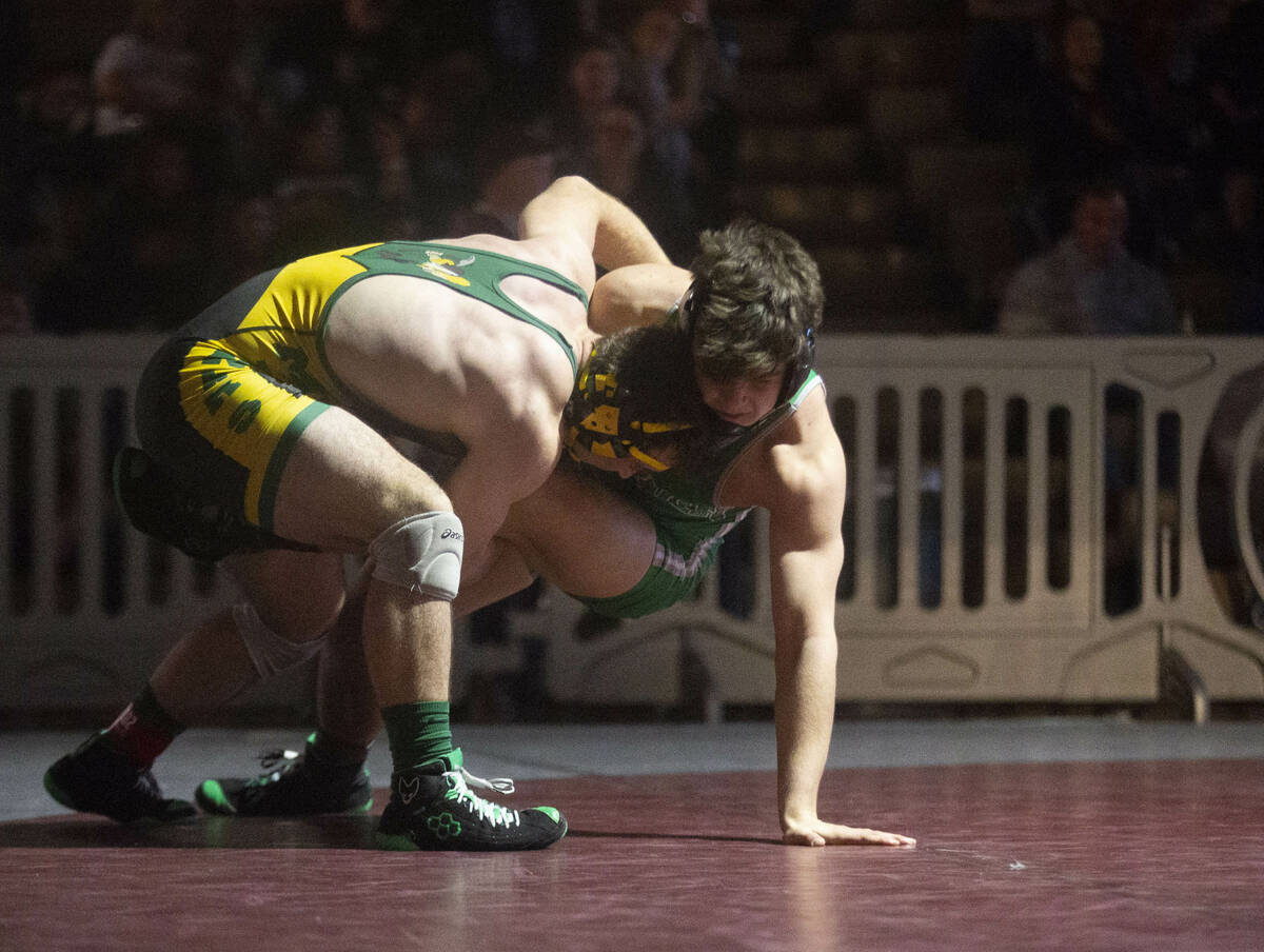 Bishop Manogue High School’s Ryan Rutherford, left, scores a takedown against SLAM Nevad ...