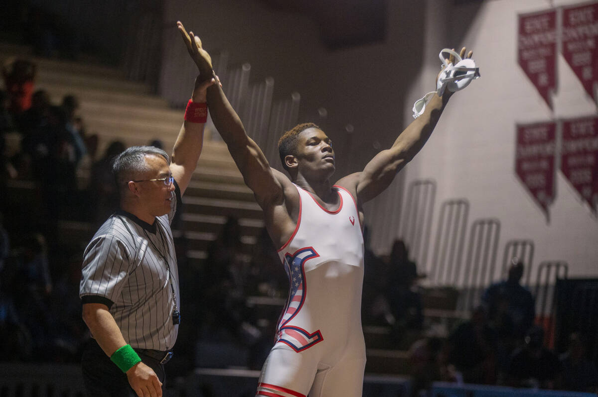Liberty High School’s Melvin Whitehead, right, celebrates his victory over Reno High Sch ...