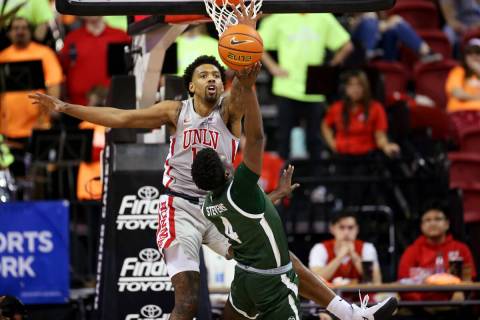 UNLV’s Royce Hamm Jr. (14) defends against Colorado State’s Isaiah Stevens (4) in ...